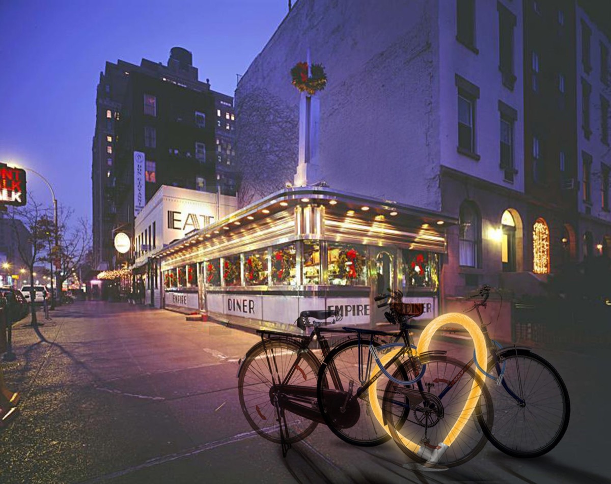 A glowing yellow heart-shaped rack composited into a dusk photograph of a Manhattan diner, two bikes parked against it