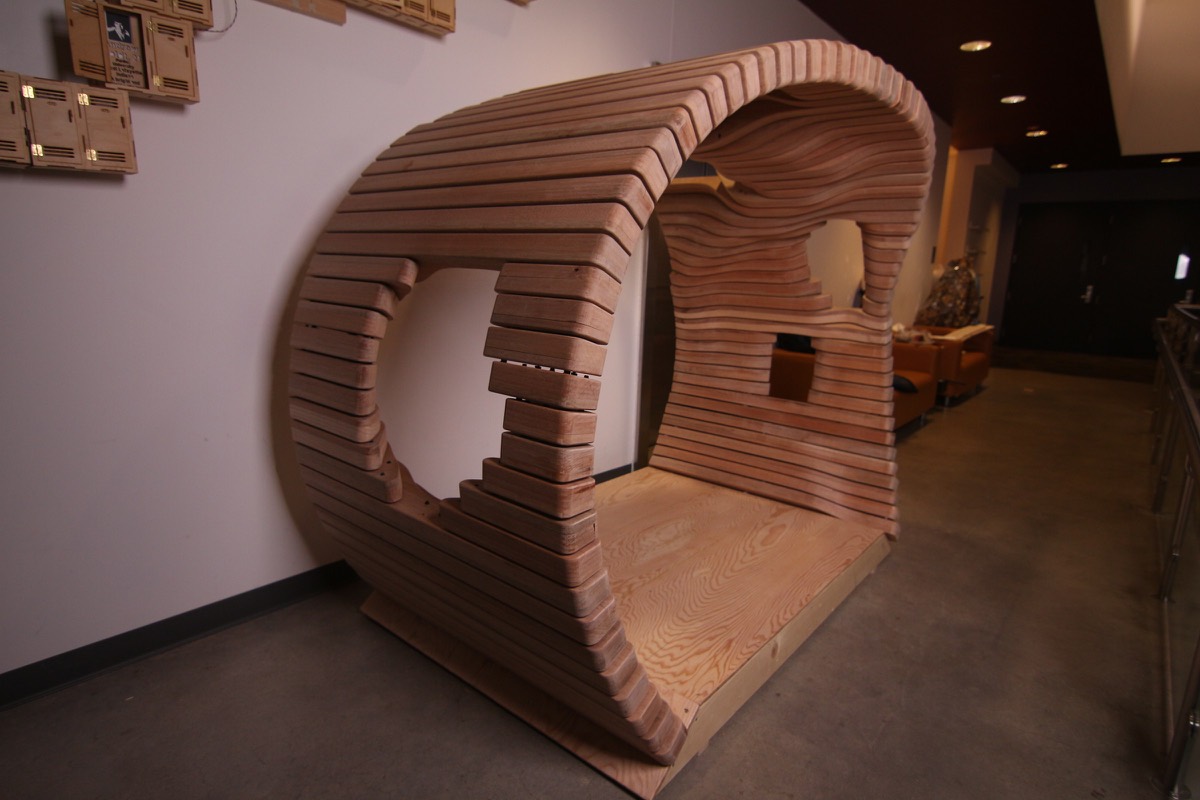 A plywood rib structure standing in the studio