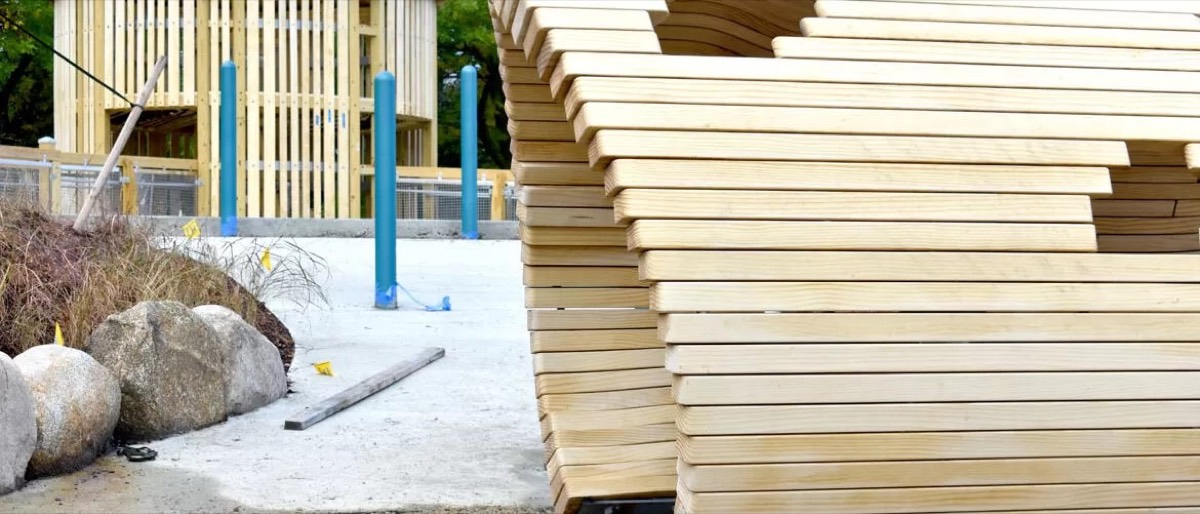 Shaped planks stacked beside the park's timber gazebo