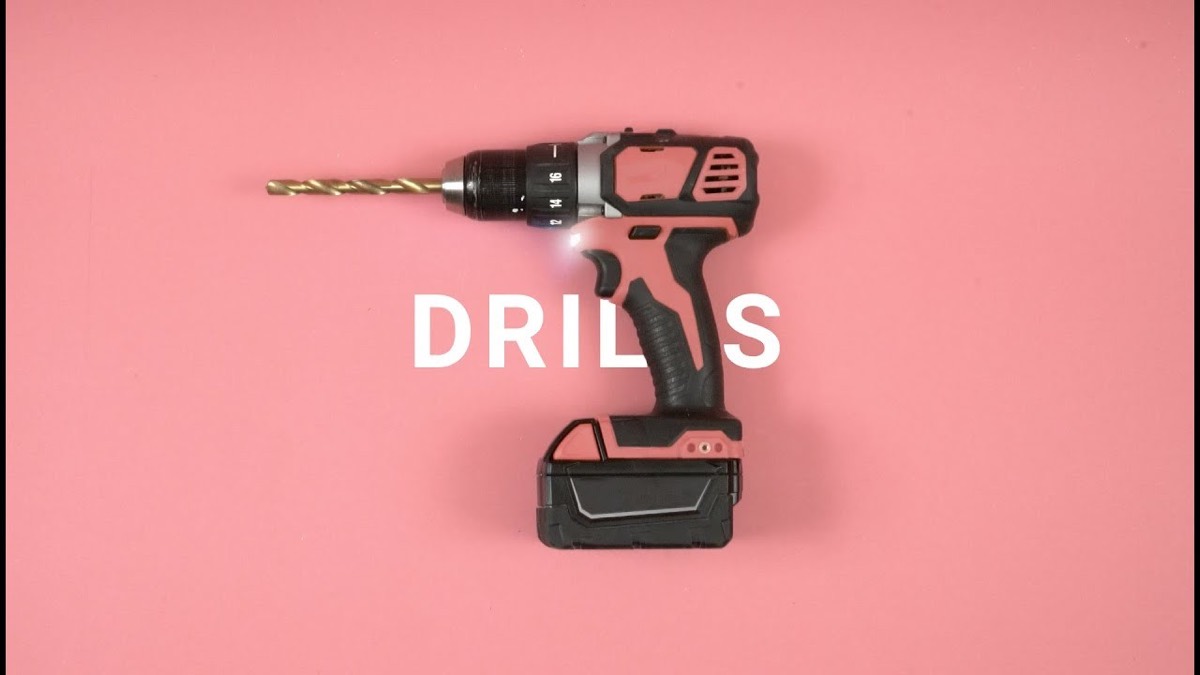 A cordless drill on pink under the word DRILLS